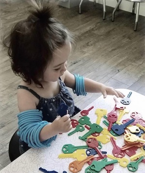 Child playing with toy keys